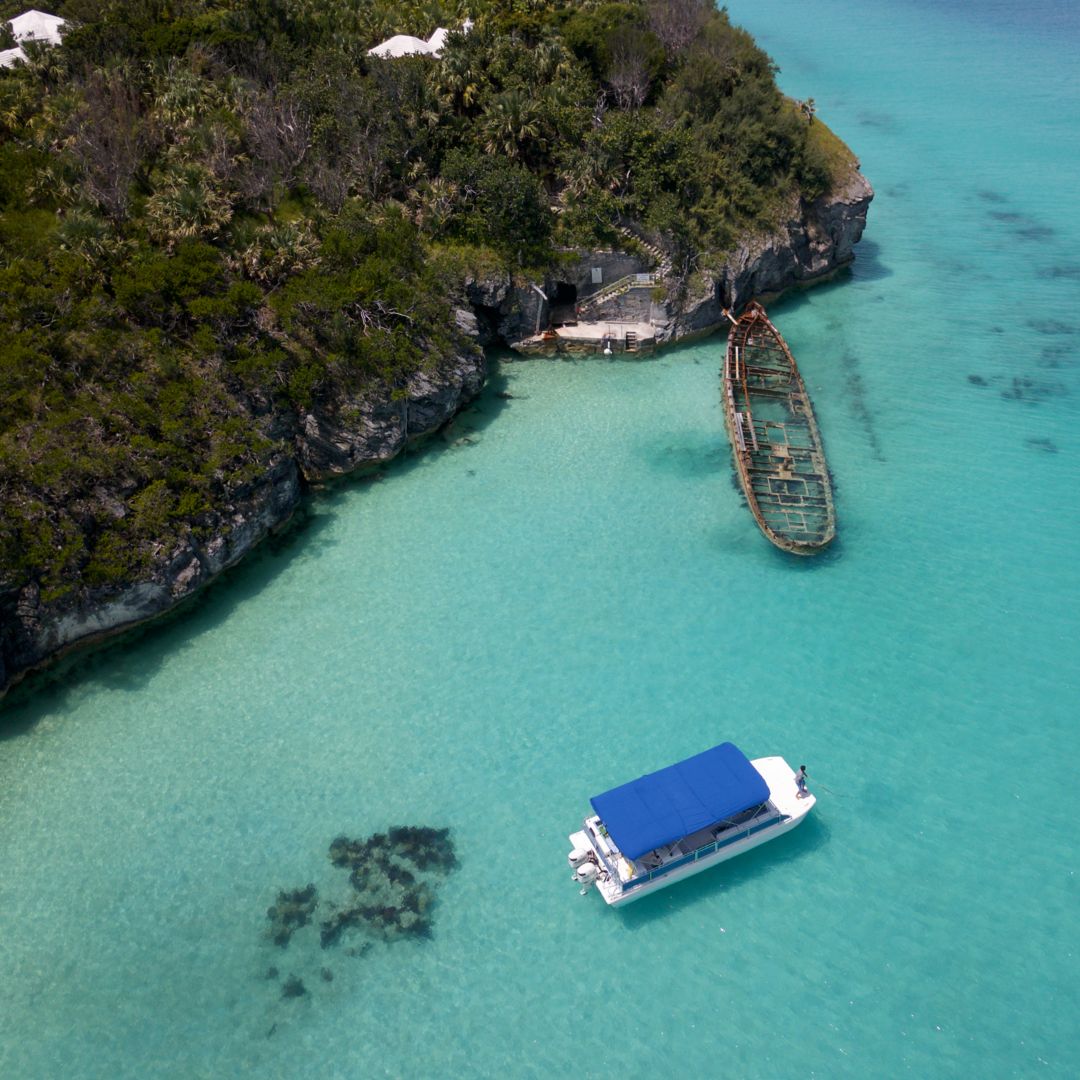 Castaway yacht floating near shipwreck